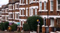 A woman walks past houses ‘To Let’ in a residential street in London, Britain, September 27, 2022. REUTERS/Hannah McKay    