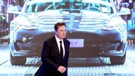 FILE PHOTO: Tesla Inc CEO Elon Musk walks next to a screen showing an image of Tesla Model 3 car during an opening ceremony for Tesla China-made Model Y program in Shanghai, China January 7, 2020. REUTERS/Aly Song/File Photo