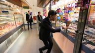 Chancellor of the Exchequer Rishi Sunak looks at a sweet shop during a visit to Bury Market in Lancashire, the day after presenting his budget to the House of Commons. Picture date: Thursday October 28, 2021.
