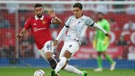 (L-R) Manchester United's Bruno Fernandes and Liverpool's Roberto Firmino during a Premier League match in August 2022. Pic: AP