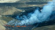 A aerial shot of activity from the Fagradalsfjall volcano in Iceland on Wednesday Aug. 3, 2022, which is located 32 kilometers (20 miles) southwest of the capital of Reykjavik and close to the international Keflavik Airport. Authorities in Iceland say a volcano in the southwest of the country is erupting just eight months after its last eruption officially ended. (AP Photo/Ernir Snaer)