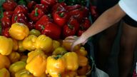 A customer picks peppers at a market in Singapore January 29, 2018. REUTERS/Soe Zeya Tun
