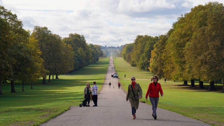 Visitors to Windsor Great Park make their way up the Long Walk towards Windsor Castle. Picture date: Thursday September 29, 2022.
