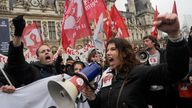 Demonstrate gather outside the Paris town hall, Friday, April 14, 2023 in Paris. France's Constitutional Council on Friday approved an unpopular plan to raise the retirement age to 64, in a victory for French President Emmanuel Macron after three months of mass protests over the legislation that have damaged his leadership. (AP Photo/Lewis Joly)