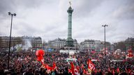 Protesters gathering at Place de la Bastille during a rally in Paris, Thursday, march 23, 2023. French unions are holding their first mass demonstrations Thursday since President Emmanuel Macron enflamed public anger by forcing a higher retirement age through parliament without a vote. Placard left, depicting French President Emmanuel Macron that reads, "my pension before yours."(AP Photo/Thomas Padilla)