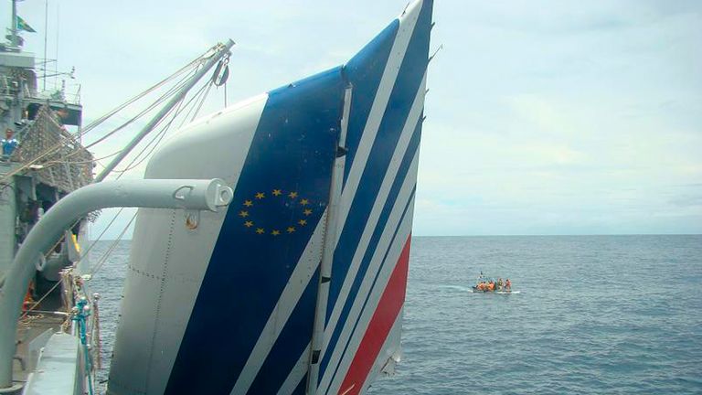 The Brazilian Navy picks debris from Air France flight AF447 out of the Atlantic Ocean, some 745 miles (1,200 km) northeast of Recife, in this handout photo distributed by the Navy in Recife, northeastern Brazil June 9, 2009. Air France flight 447 crashed en route to Paris from Rio de Janeiro, killing all 228 people on board in an incident experts are still trying to understand as French and Brazilian teams scour deep Atlantic waters for its black box voice and data recorders. 