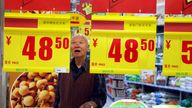 --FILE--A Chinese customer looks at the price tags at a supermarket in Nantong city, east Chinas Jiangsu province, 19 May 2010.....Chinas consumer price index (CPI), the countrys gauge for inflation, rose 4.4% in October from a year earlier, accelerating from Septembers 3.6% rise, government data showed Thursday (11 November 2010). The producer price index, a gauge of factory-gate prices, rose 5.0% in October from a year earlier, higher than Septembers 4.3% rise and above the median 4.6% rise economists had expected. The CPI rose 3.0% the January-October period from a year earlier, and the PPI rose 5.5%.