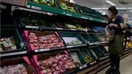 A shopper puts fruit in her basket in a supermarket in London, Wednesday, Aug. 17, 2022. The UK inflation rate has hit 10.1% in the year to July, new figures from the Office for National Statistics have shown. The figure is up from 9.4% in June and is at its highest level in more than 40 years. (AP Photo/Frank Augstein)