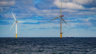 EMBARGOED TO 0001 WEDNESDAY SEPTEMBER 6 File photo dated 26/07/2022 of a ship passing wind turbines at RWE's Gwynt y Mor. Private sector investment worth up to ££100 billion is needed to deliver key projects to safeguard UK energy security, according to the offshore energies industry.