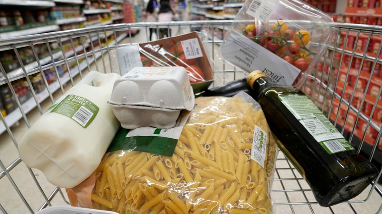 A basket of groceries a trolly at a supermarket in London, Saturday, June 10, 2023. High food prices are pinching households across Europe, where food inflation is outpacing other major economies like the U.S., Japan and Canada. Some governments have responded with formal price controls or loose agreements with supermarkets to keep costs down. (AP Photo/Alastair Grant)