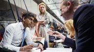 Rishi Sunak working on the plane with his senior advisors on the way to Saudi Arabia