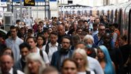 Passengers walk along a platform after disembarking a busy train at Waterloo station, on a day of heavily reduced rail service on the third day of national rail strikes, in London, Britain, June 23, 2022. REUTERS/Henry Nicholls