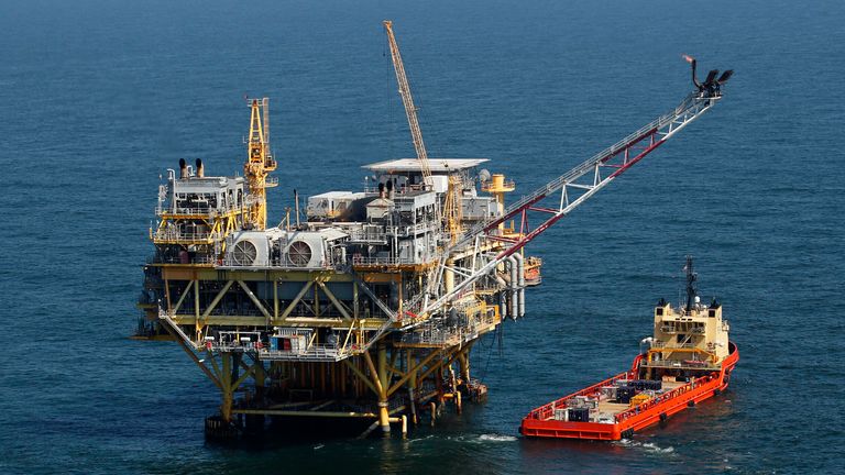 FILE - A rig and supply vessel are pictured in the Gulf of Mexico off the cost of Louisiana, April 10, 2011. A federal judge has ordered the Interior Department to expand next week...s scheduled sale of Gulf of Mexico oil and gas leases by millions of acres. The Thursday, Sept. 22, 2023, ruling rejected a scaled-back plan announced last month by the Biden administration as part of an effort to protect an endangered whale species. (AP Photo/Gerald Herbert, File)