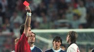 FILE - England's David Beckham receives a red card from Danish referee Kim Milton Nielsen for kicking Argentina's Diego Simeone, during England's World Cup second round soccer match against Argentina, in Saint Etienne, France on June 30, 1998. England lost on penalties after the match ended 2-2. A four-part Netflix series, 