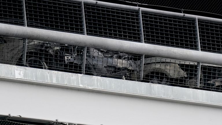 The burnt out shells of cars, in a multi-storey car park at Luton Airport