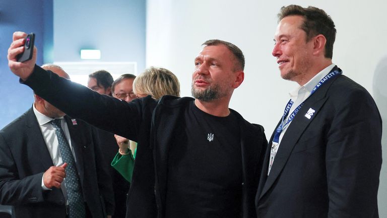 Ukraine's Deputy Minister of the Digital Transformation Georgi Dubyinsk  and Elon Musk take a selfie during the opening plenary at the AI safety summit