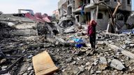 Palestinians inspect the rubble of a building of the Al Nawasrah family destroyed in an Israeli strike in Maghazi refugee camp, central Gaza 
Pic:AP