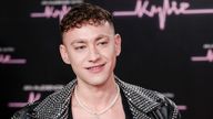 Olly Alexander poses for photographers upon arrival for 'An Audience with Kylie' at the Royal Albert Hall, in London, Friday, Dec. 1, 2023. (Photo by Millie Turner/Invision/AP)