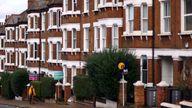 A woman walks past houses ‘To Let’ in a residential street in London, Britain, September 27, 2022. REUTERS/Hannah McKay