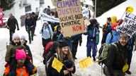 People attend a climate protest rally by Swiss party 'Juso' and the organization 'Strike WEF' on the eve of the 52nd annual meeting of the World Economic Forum (WEF) in Davos, Switzerland, Sunday, January 15, 2023. The meeting brings together entrepreneurs, scientists, corporate and political leaders in Davos under the topic 'Cooperation in a Fragmented World' from 16 to 20 January. (Gian Ehrenzeller/Keystone via AP)