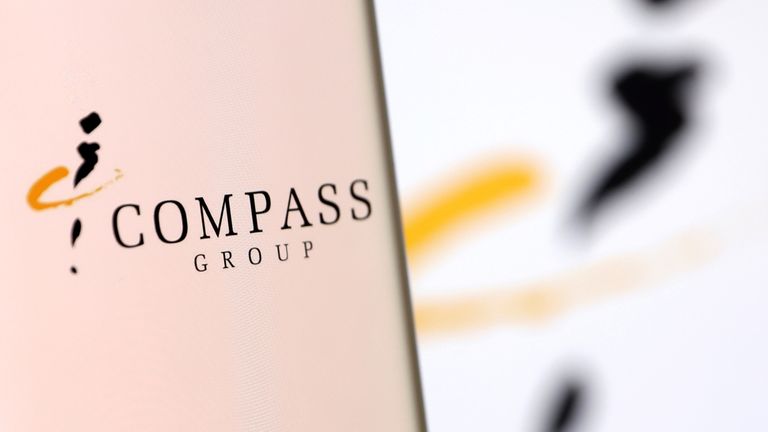 Compass Group's logo is pictured on a smartphone in this illustration taken, December 4, 2021