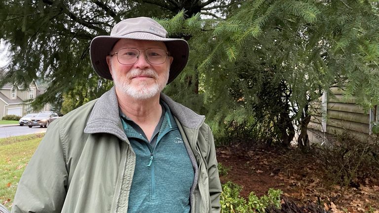 High school physics teacher Bob Sauer stands in front of his home in southwest Portland, Ore., Monday, Jan. 8, 2024. Sauer found the exit door plug that blew off Alaska Airlines flight 1282 in his backyard. The chunk of Boeing 737 Max 9 fuselage detached during the flight on Friday, Jan. 5, leaving a gaping hole in the side of the plane. (AP Photo/Claire Rush)