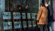 People look at properties on display in the window of Winkworth estate agents in Islington, London, Britain, December 10, 2021. Picture taken December 10, 2021. REUTERS/May James