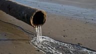 Pipe pumping sewage water at the beach at the seaside resort of Borth on Cardigan Bay near Aberystwyth,Ceredigion,Wales,UK
