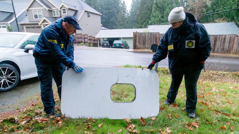 National Transportation Safety Board (NTSB) investigators examine the fuselage plug area of Alaska Airlines Flight 1282 Boeing 737-9 MAX 
Pic:NTSB/Reuters