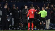 Birmingham City's Juninho Bacuna talks with the referee David Webb and fourth official after he was racially abused by a West Brom fan. Pic: Reuters