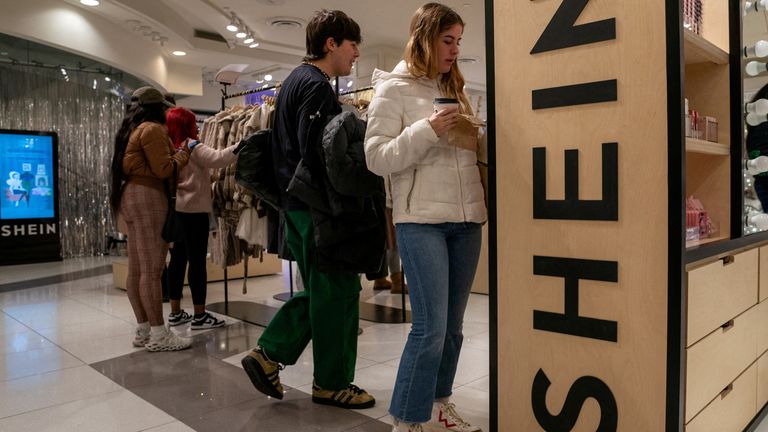 FILE PHOTO: People shop at the Shein Holiday pop-up shop inside of Times Squares Forever 21 in New York City, U.S., November 10, 2023.REUTERS/David 'Dee' Delgado/File Photo