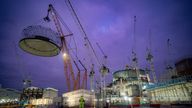 Engineering teams use the world's largest crane - Big Carl - to lift a 245-tonne steel dome onto Hinkley Point C's first reactor building, at the nuclear power station construction site in Bridgwater, Somerset. The 14-metre tall dome is manoeuvred into position on top of the 44-metre high reactor building in the early hours of Friday morning. This milestone in the construction closes the reactor building, allowing the first nuclear reactor to be installed inside. Picture date: Friday December 15