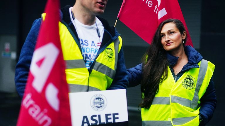 Members of the Aslef union on a picket line at Euston station in London 