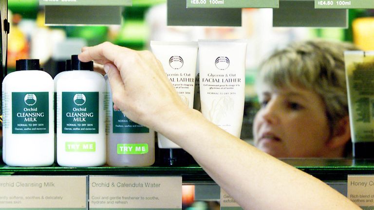 A customer reaches for a Body Shop product inside their store in Rugby town.
Pic: Reuters