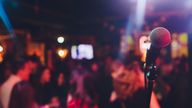 microphone against blur on beverage in pub and restaurant background