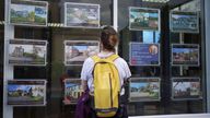 A woman browsing properties. Pic: PA