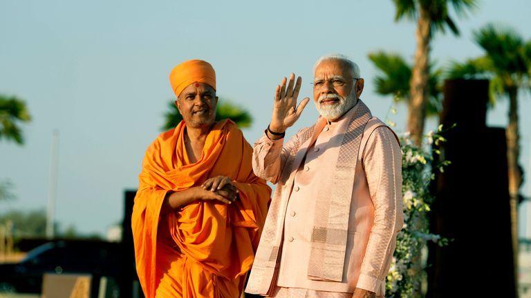 Indian Prime Minister Narendra Modi, right, waves as he arrives for the opening ceremony of the first stone-built Hindu temple in the Middle East
Pic: AP