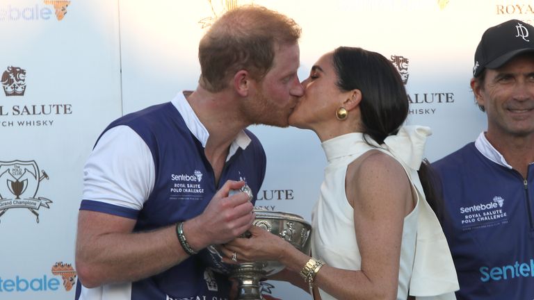 The Duchess of Sussex presents the trophy to her husband, the Duke of Sussex after his team the Royal Salute Sentebale Team defeated the Grand Champions Team, in the Royal Salute Polo Challenge, to benefit Sentebale, at The USPA National Polo Center in Wellington, Florida, US. Picture date: Friday April 12, 2024.

