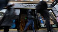 People walk past a Ted Baker retail store in London, Britain, March 19, 2024. REUTERS/Toby Melville