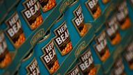 FILE PHOTO: Tins of Heinz Baked Beans rest on a palette in the company's factory in Wigan, northern England, May 21, 2009. REUTERS/Phil Noble/File Photo
