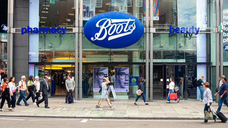 London, UK - July 18, 2019: People walking in front of the Boots pharmacy on Oxford Street, London. Oxford Street is one of the most famous shopping streets in the London.