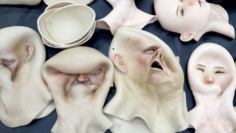 Heads for humanoid robots lie on a table at the office of developer Ex-Robots in Dalian, Liaoning province, China.
Pic:Reuters