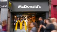 People walk past McDonald's store in London, Britain July 27, 2022. REUTERS/Maja Smiejkowska