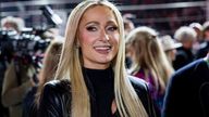 LAS VEGAS, NV - NOVEMBER 18: Paris Hilton walks on the grid before the F1 Las Vegas Grand Prix on Saturday, November 18, 2023 on the Las Vegas Street Circuit in Las Vegas, NV. (Photo by Bob Kupbens/Icon Sportswire) (Icon Sportswire via AP Images)