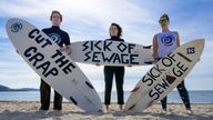 EDITORIAL USE ONLY NOTE LANGUAGE ON PLACARDS Lucy Luck, Evelyn Hull and Emily van de Geer take part in a protest by Surfers Against Sewage (SAS), in Falmouth, who are calling for an end to the sewage discharges plaguing the UK's rivers and seas. Picture date: Saturday May 18, 2024.

