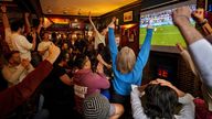 People are seen enjoying the football at the pub. Pic: AP