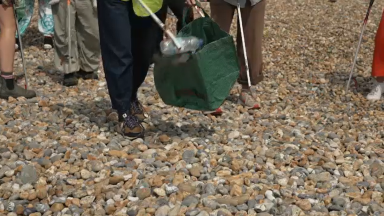 Volunteers collecting plastic on the beach