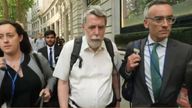 Gareth Jenkins (centre) is shown leaving the inquiry after his first day of evidence