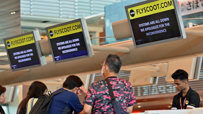 Passengers being checked in manually at Changi Airport Terminal 1 in Singapore. Pic: Reuters