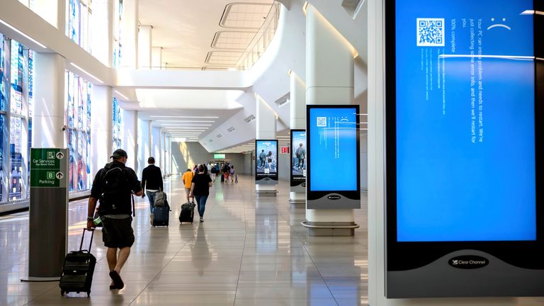 A blue error message at a departure floor in LaGuardia Airport, New York. Pic: AP